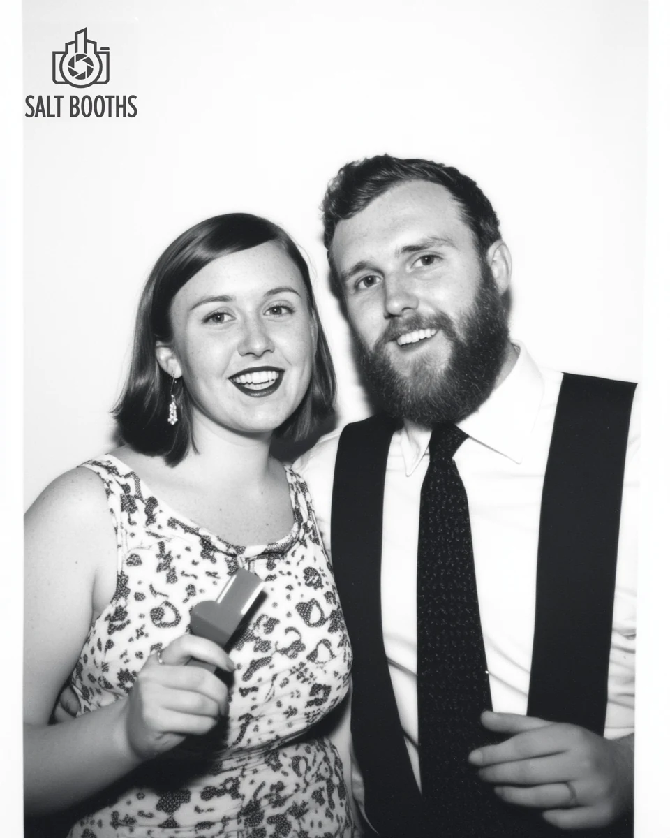 Black-and-white Glam booth portrait of a couple, soft film look